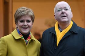 Former First Minister for Scotland and former leader of the Scottish National Party (SNP), Nicola Sturgeon, stands with her husband husband Peter Murrell.   (Photo by ANDY BUCHANAN / AFP) (Photo by ANDY BUCHANAN/AFP via Getty Images)