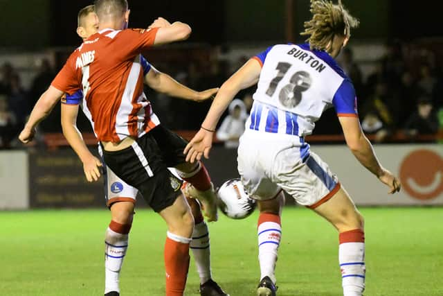 Altrincham’s Lewis Baines is challenged by Hartlepool United’s Kieran Burton (photo Frank Reid)