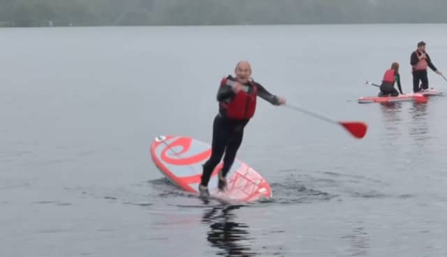 Lib Dem leader Sir Ed Davey falls into lake.