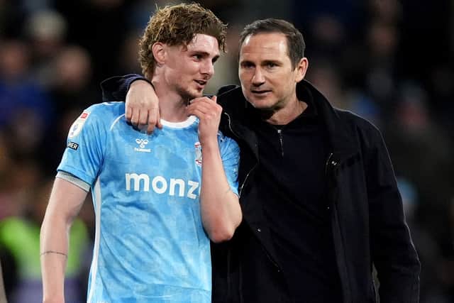 Coventry City head coach Frank Lampard (right) speaks with Jack Rudoni (left) after the Sky Bet Championship match on Friday