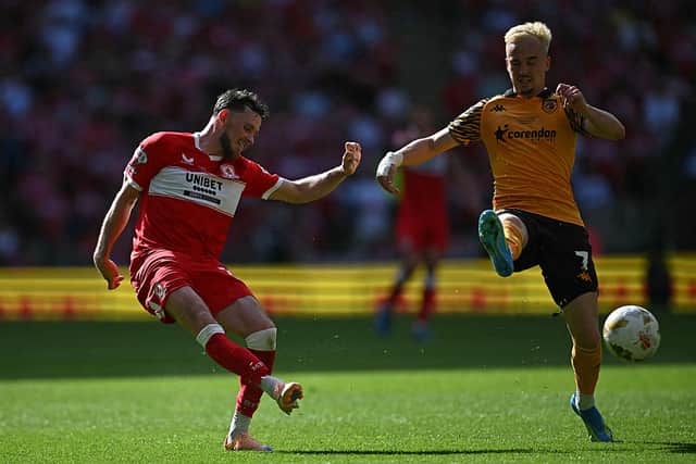 Middlesbrough's Irish midfielder Alan Browne shoots past Hull City's Canadian midfielder Liam Millar.