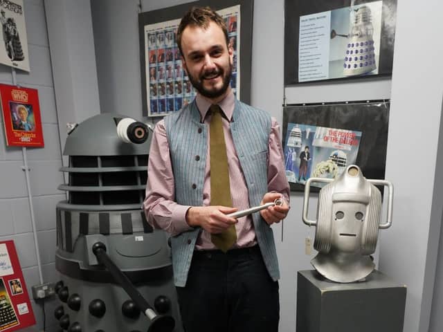 Auctioneer Hamish Trower with some of the lots in the auction of a Dr Who collection.