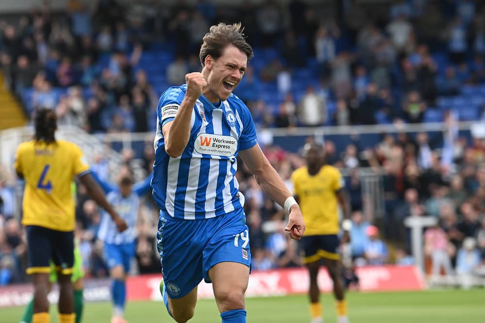 Chris Popov celebrating a goal.