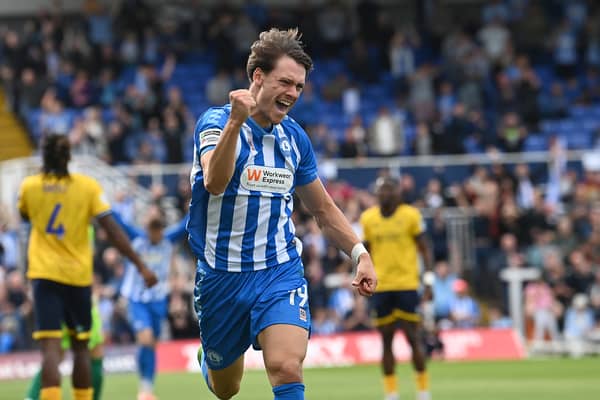 Chris Popov celebrating a goal.