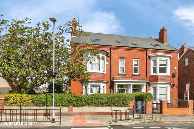 The substantial semi-detached home occupies a generous corner position with gated driveway parking