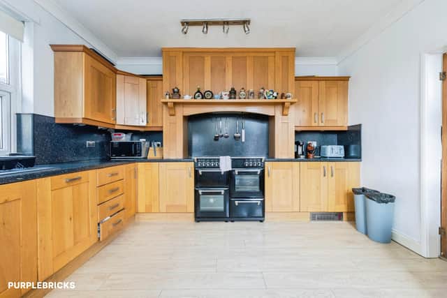 High-end oak units, a range cooker and integrated appliances feature in the property's premium fitted kitchen