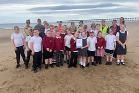 West View Primary School pupils are pictured with staff and parents with their award.