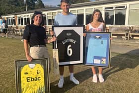 Louise Jackson (left) is pictured with her two children Max and Martha with some of the auction items. 