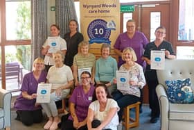 Staff and residents at Wynyard Woods celebrate their perfect 10 score
