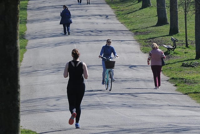 Cycling, running or walking? Whatever suits for these people in Roundhay Park.