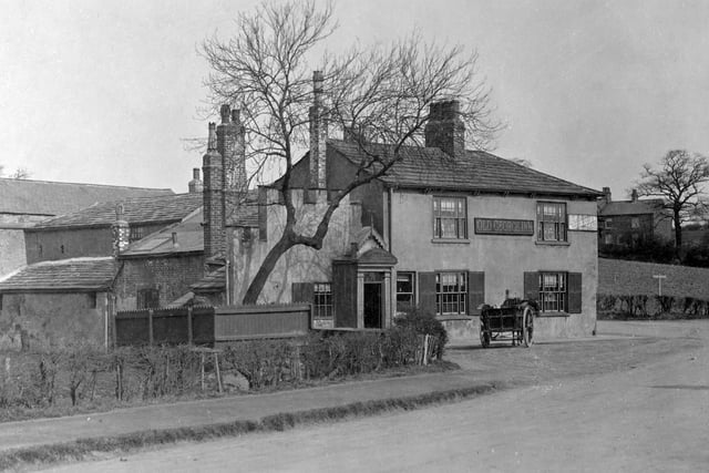 Postcard view of the Old George Inn at Garforth Bridge, West Garforth. It stands at the junction of Selby Road with Wakefield Road and the photograph was taken from the other side of Selby Road.