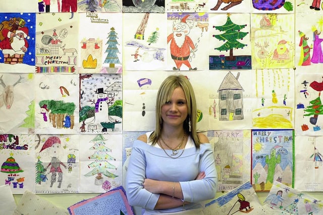 Kathryn, of Thornes, Wakefield, looking at some of the Christmas drawings by children which were on display at the Wakefield Art Gallery, Wakefield in January 2004.