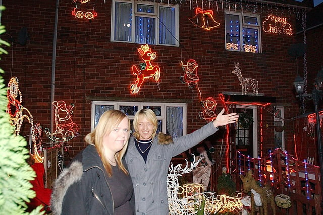 Val and Natalie pose outside their well-decorated house in Gawthorpe in December 2005.