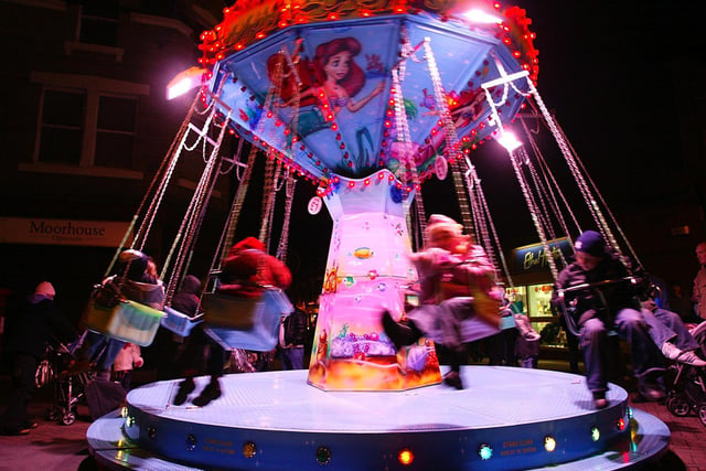Families enjoy a funfair at the Christmas Lights switch on in Normanton, November 2005.