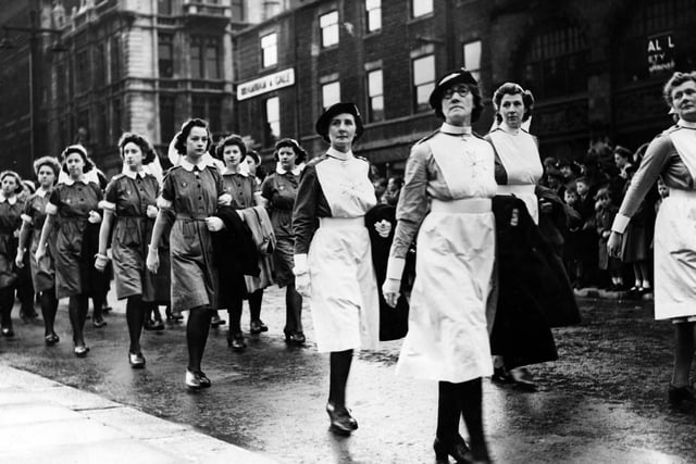 A contingent of St John's Ambulance Brigade nurses, on parade down The Headrow.