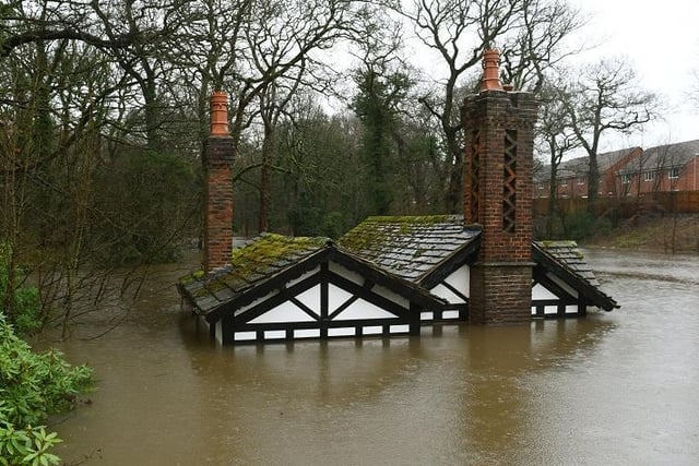 The Grade-II listed Ackhurst Lodge in Chorley nearly submerged by floodwater