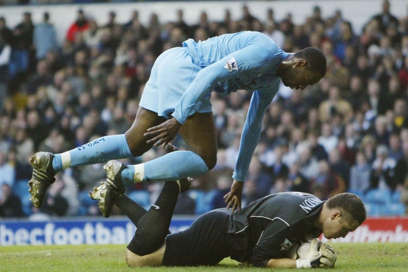 Paul Robinson protects the ball from Tottenham Hotspur's Ledley King during the Premiership clash at Elland Road in January 2004.