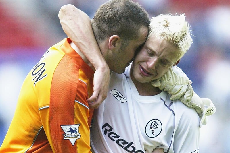 An inconsoble Paul Robinson and striker Alan Smith at full time after losing 4-1 against Bolton Wanderers at the Reebok Stadium in May 2004, a result which left the Whites effectively relegated.