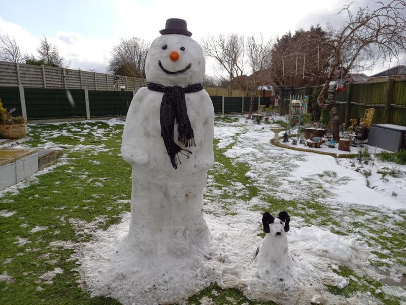 Snow man with snow pup!