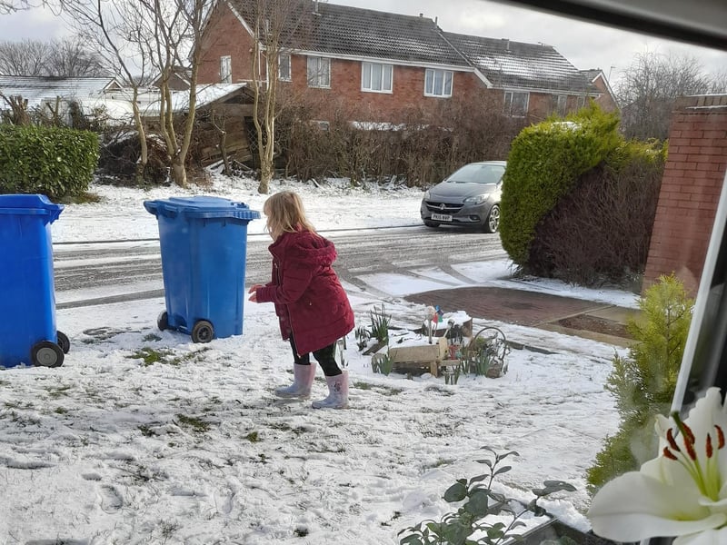 Throwing snowballs.
