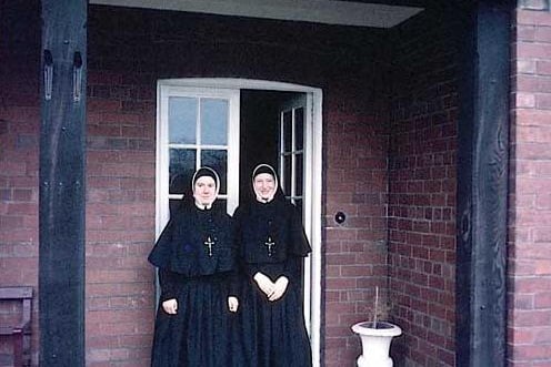 May 1967. Two sisters of the Holy Family of Wetherby stand in front of the entrance of the convent adjoining St. Joseph's Catholic Primary. The sisters of the Holy Family originated from Mount St. Mary's in Leeds and came to Wetherby in the 1930s.