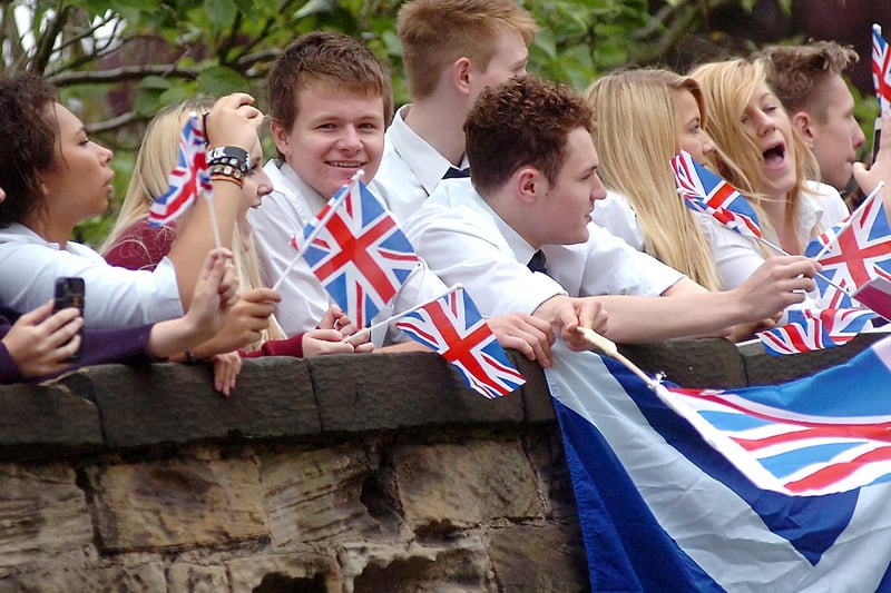 School pupils cheered and waved union flags as the torch passed by.