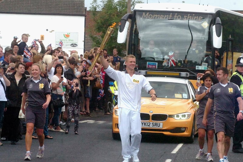 Thousands of people lined the streets of Pontefract to get a glimpse of the torch passing by.