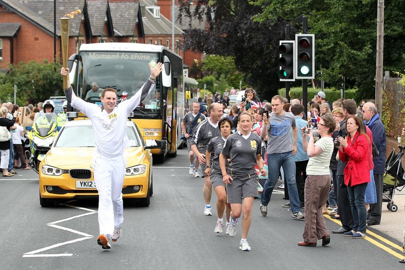 The Olympic torch procession passing through Pontefract.