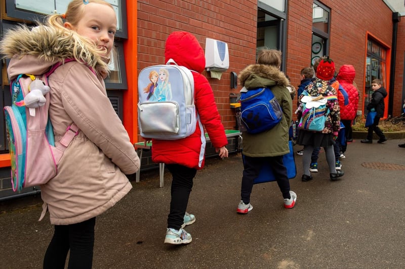 Children file back into their classrooms.