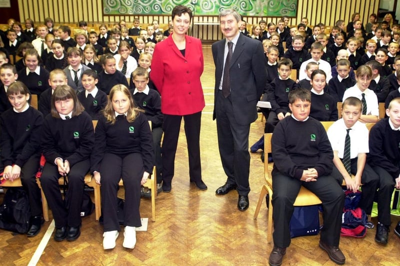 September 2001 and pupils at fire-hit Crawshaw High pupils returned to school. Pictured left, Tracey Coy (Head of Year) and Nigel Turner (Head Teacher) with year 7 pupils looking on.
