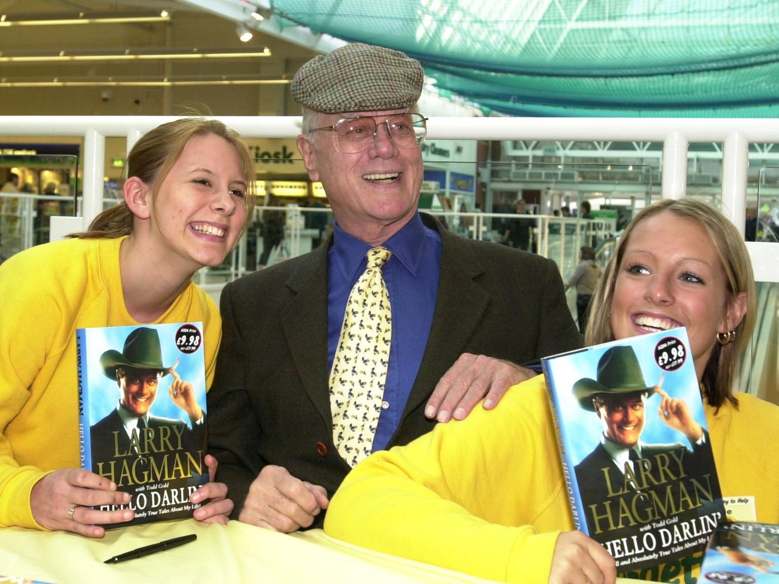Actor Larry Hagman, best known as JR in Dallas, visited Asda's Owlcotes Centre store for a book signing. He is pictured with Asda employees Tanya Troutner, left  and Ashlie McGreavy, right.