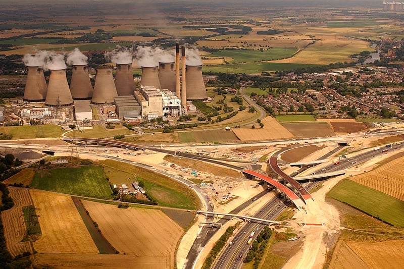 Work is carried out to construct the road where the A1(M) meets the M62, close to Ferrybridge Power Station. In the background are Eggborough and Drax power stations.