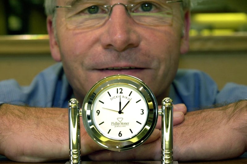 Jeweller Phillip Stoner with a miniature Dickie Bird clock at his shop in Pudsey.