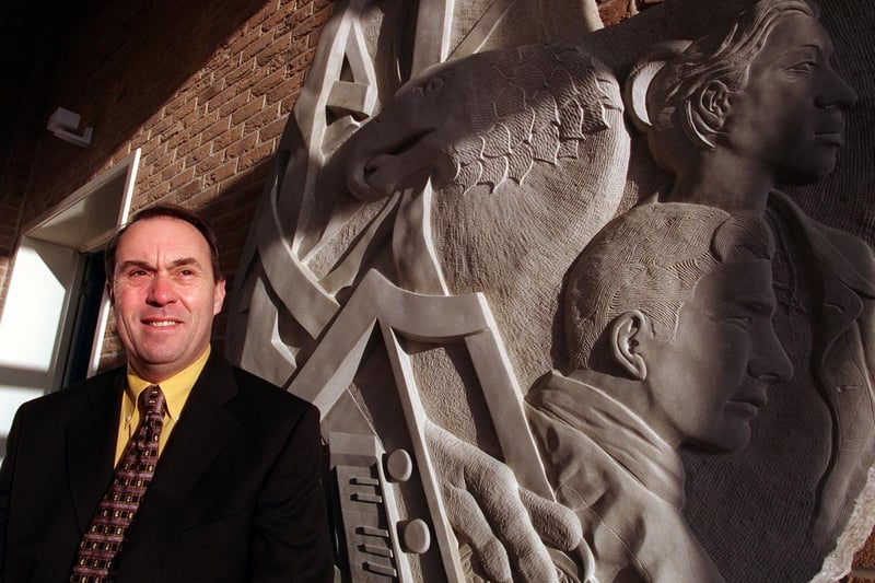 Janjuary 1999 and head teacher at Morley High, Dr Roland Walker, with a new statue depicting a phoenix rising from the flames.