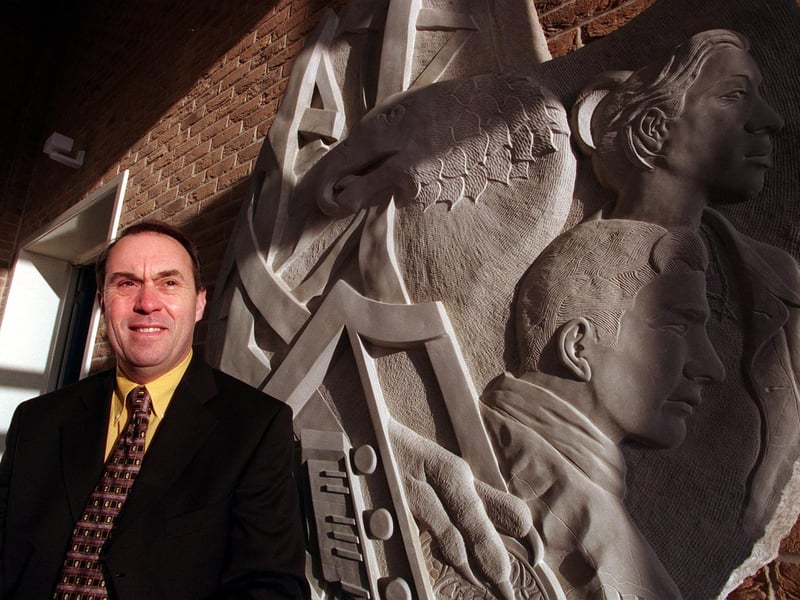 Janjuary 1999 and head teacher at Morley High, Dr Roland Walker, with a new statue depicting a phoenix rising from the flames.