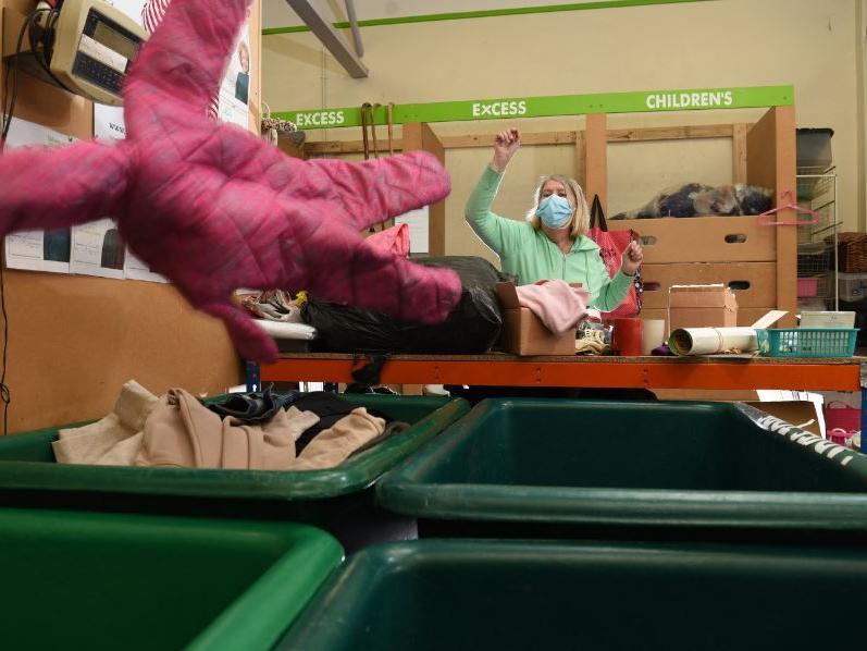 Suzanne Wharton sorts through bags of donations dropped off this week