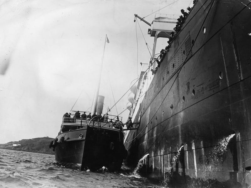 Survivors of the Titanic board a tug from the liner which rescued them, April 1912.
The wreckage wasn’t discovered until 1985, 70 years after she sunk.