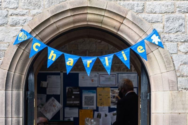 Blue bunting with Charlie's name written on it brightened up the church