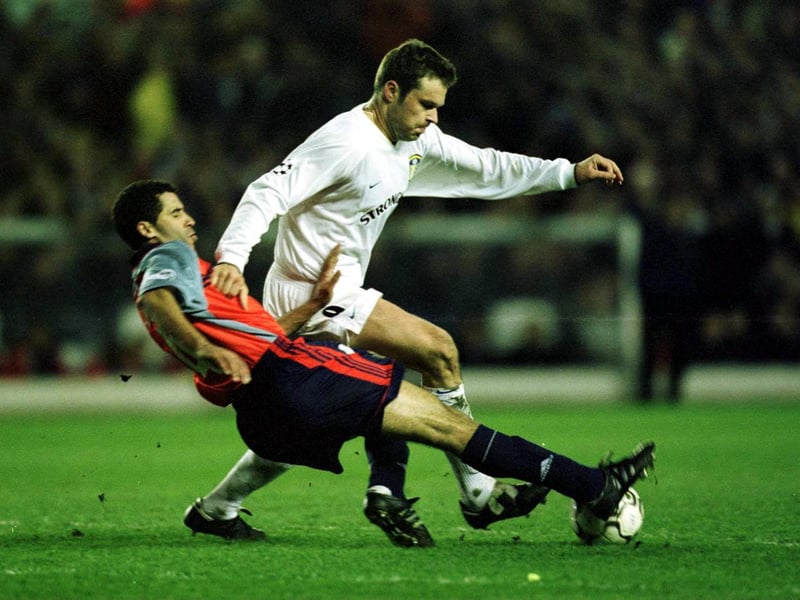 Marko Viduka holds off Deportivo's Nourredine Naybet.