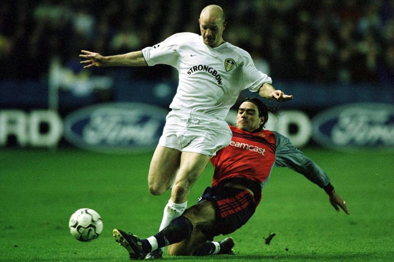 Danny Mills is tackled by Deportivo's Pedro Duscher.