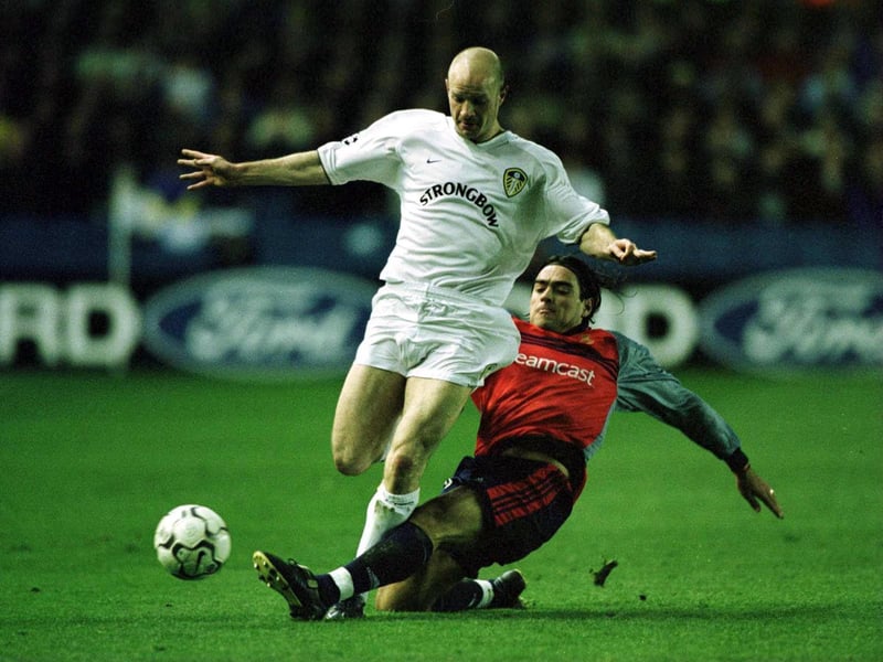 Danny Mills is tackled by Deportivo's Pedro Duscher.