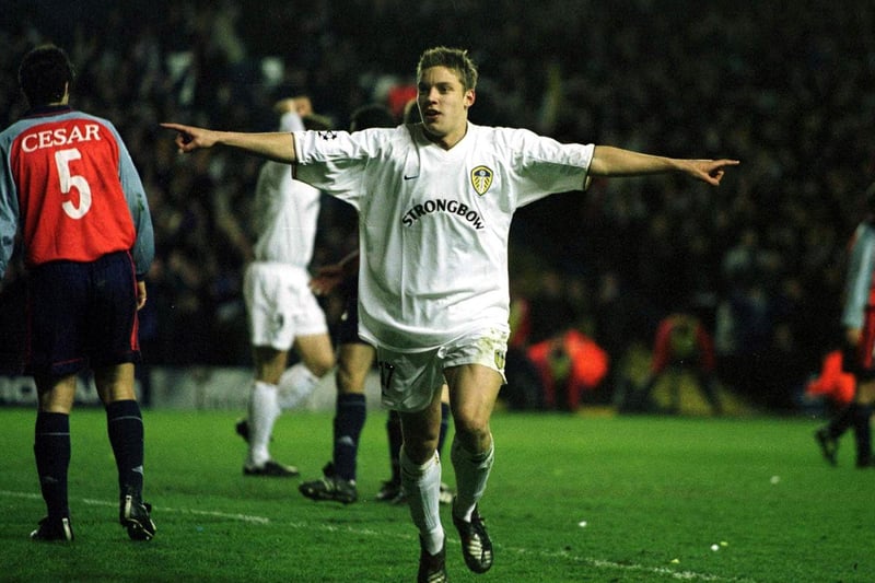 Striker Alan Smith celebrates after heading home a cross from Harry Kewell.