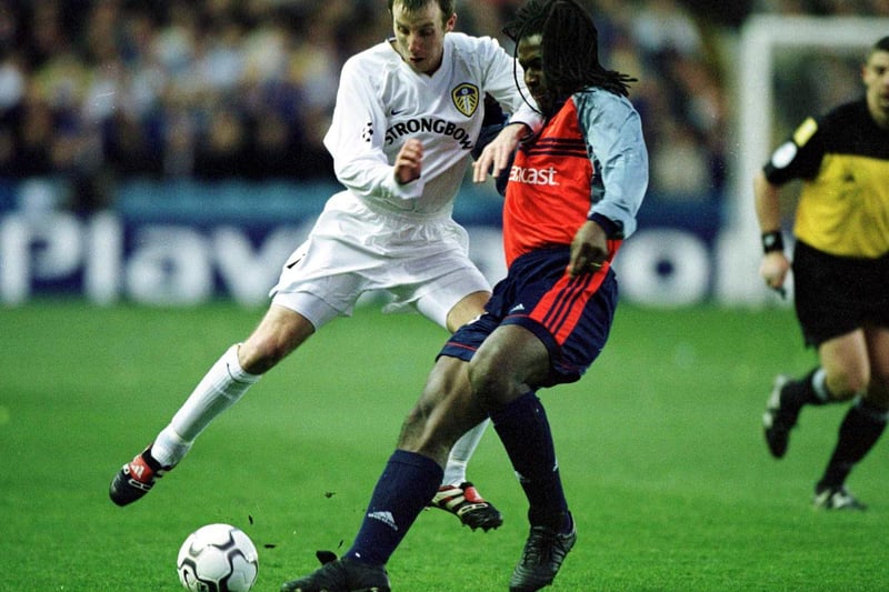 Deportivo's Emerson holds off Lee Bowyer.