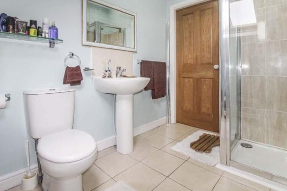 The Jack and Jill en suite comprising of separate shower cubicle, wash hand basin, w.c, skylight window.