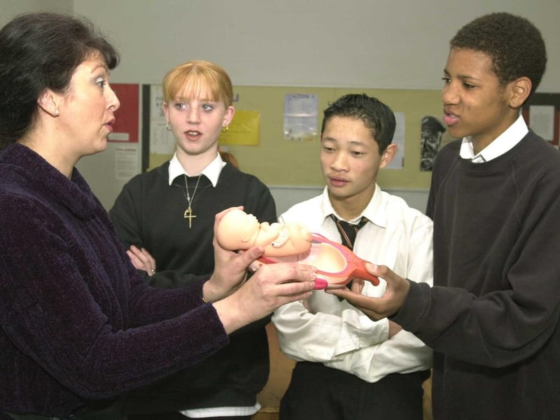 April 2000 and pictured is midwife Moira Mohit with pupils Lisa Russell, Vin Hoang and Michael Maynard in a personal health and social education lesson as part of the I'Too project.