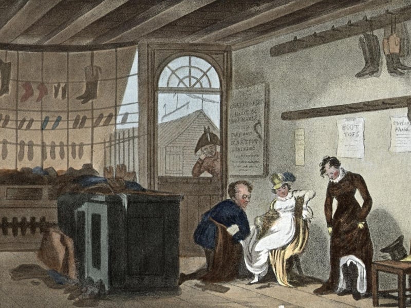 An assistant helps customers in a boot and shoe shop. Original Publication: Political Sketches of Scarborough - pub. 1813