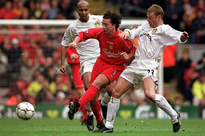 David Batty of Leeds clashes with Liverpool striker Robbie Fowler.
