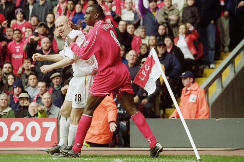 Liverpool's Emile Heskey clashes with Danny Mills.