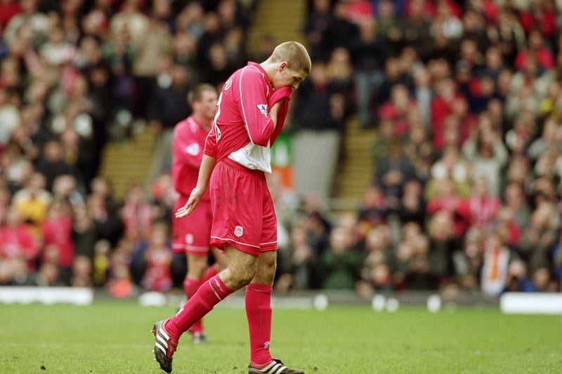 A dejected Steven Gerrard walks off the pitch after being sent off. He had earlier equalised for the Reds.