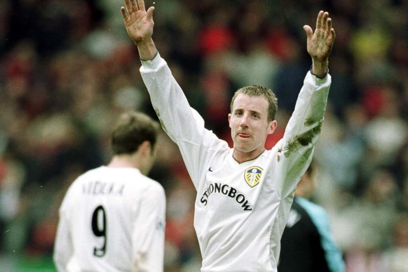 Lee Bowyer celebrates towards the travelling Leeds fans at full-time.